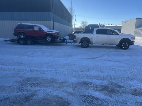 GetMyScrapCar | Tow Truck with Red SUV for Scrap Metal Recycling