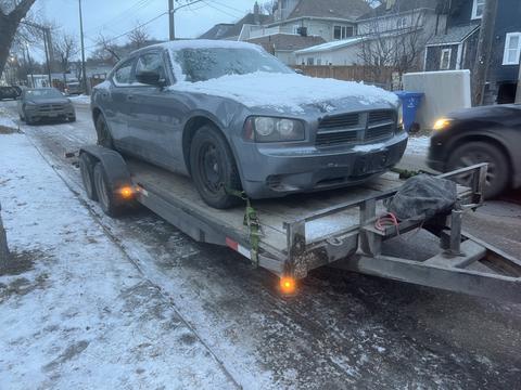 GetMyScrapCar | Junk Dodge Charger on Trailer for Scrap Car Recycling