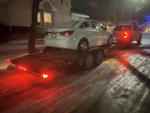 GetMyScrapCar | Chevrolet Sedan on Trailer for Junk Car Removal