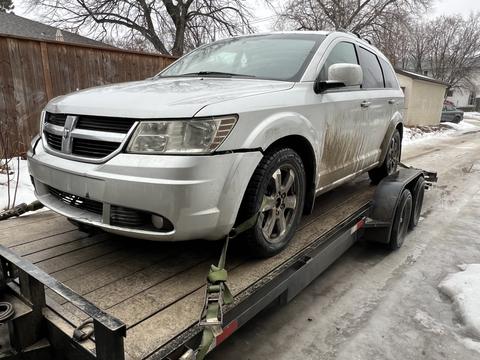 GetMyScrapCar | Dodge Journey on Tow Truck for Junk Car Removal