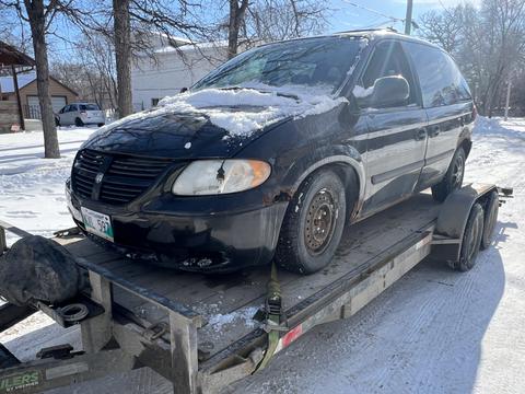 GetMyScrapCar | Dodge Minivan on Trailer for Junk Car Removal