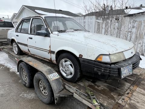 GetMyScrapCar | Junk Car Removal for a Rusted 1990s Chevrolet Sedan