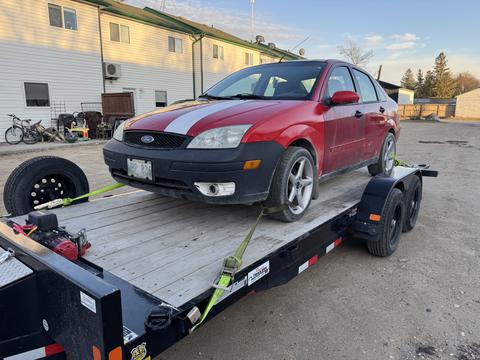GetMyScrapCar | Red Ford Focus on Trailer for Scrap Car Removal
