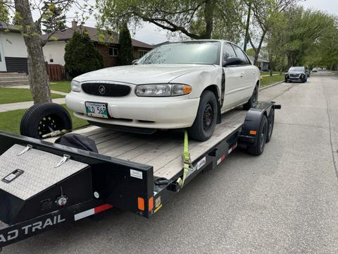 GetMyScrapCar | Junk Car Removal of a Buick Regal on Trailer
