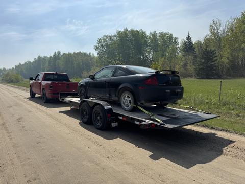 GetMyScrapCar | Junk Car Removal of a Black Dodge Neon on Trailer