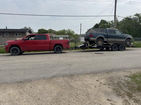 GetMyScrapCar | Dodge Truck Towing Scrap Ford SUV for Recycling