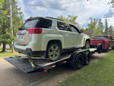 GetMyScrapCar | White GMC Terrain on Trailer for Junk Car Removal