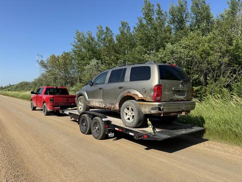 GetMyScrapCar | Junk Car Removal with a Dodge SUV and Pickup Trailer