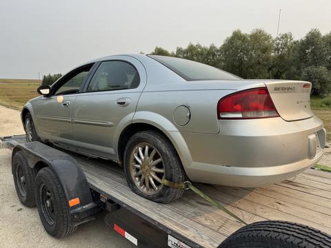 GetMyScrapCar | Silver Chrysler Sebring on Trailer for Scrap Metal Recycling