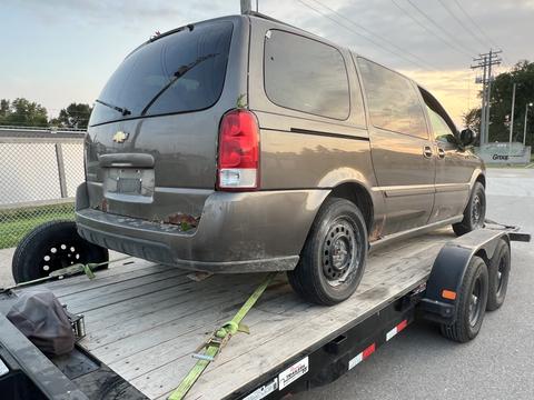 GetMyScrapCar | Chevrolet Minivan on Tow Trailer for Junk Car Removal