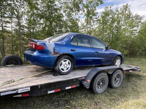 GetMyScrapCar | Junk Car Removal of a Blue Sedan for Scrap Metal Recycling