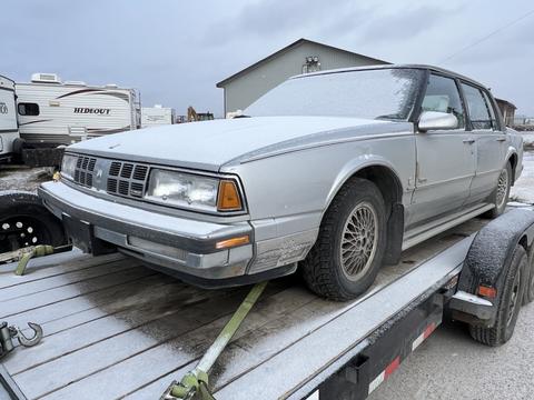 GetMyScrapCar | Old Silver Car on Trailer for Scrap Metal Recycling
